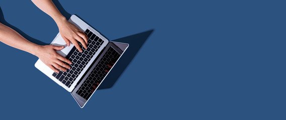 hands typing on a keyboard